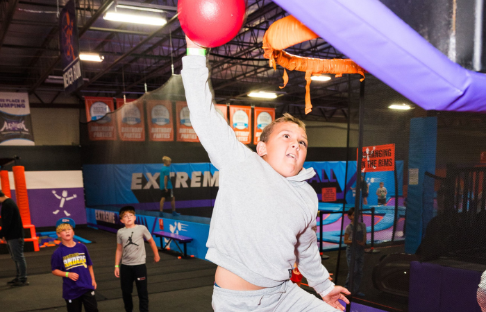 basketball trampoline dunk attraction at Altitude Trampoline Park